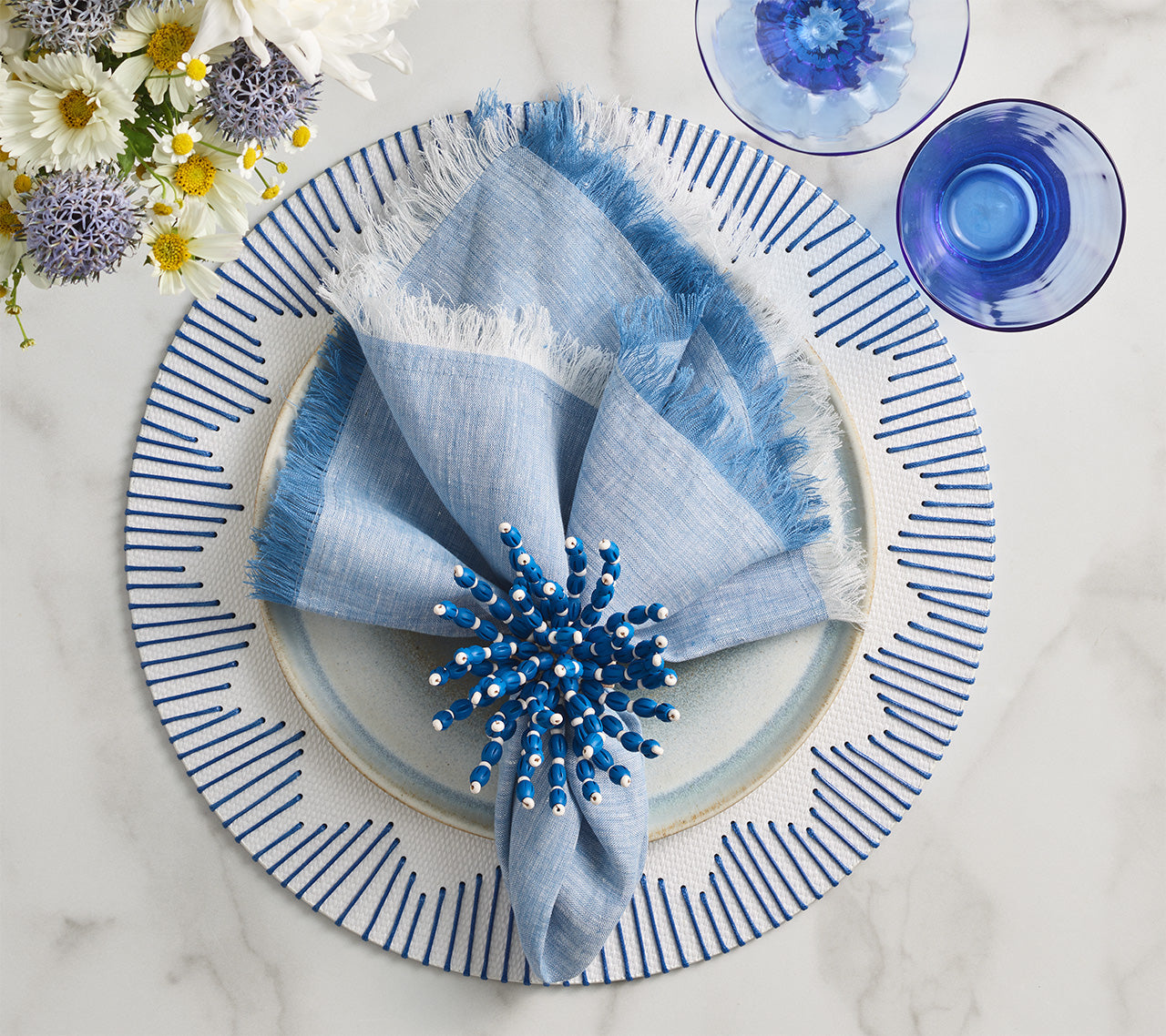 Chambray Fringe Napkin in Blue by Kim Seybert